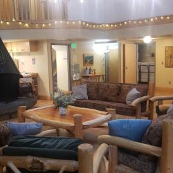 Main room with furniture around fireplace